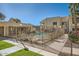 Community pool with surrounding lounge chairs at 145 N 74Th St # 108, Mesa, AZ 85207