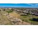 Aerial view of a golf course with houses nearby at 15140 W Gunsight Dr, Sun City West, AZ 85375