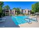 Inviting community pool with lounge chairs and an attached spa at 15380 N 100Th St # 2127, Scottsdale, AZ 85260