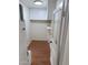 Laundry area with white cabinets, shelves, and wood flooring at 1540 E Cheery Lynn Rd, Phoenix, AZ 85014