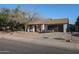 House exterior with a landscaped yard and two-car garage at 16435 N 46Th Dr, Glendale, AZ 85306