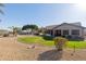 Landscaped backyard with grassy area and swimming pool at 16604 S 11Th Ave, Phoenix, AZ 85045