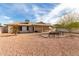 Backyard with patio area, covered patio and desert landscaping at 17218 N Desert Glen Dr, Sun City West, AZ 85375