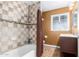 Bathroom with shower/tub combo and checkered tile at 1749 W Monterosa St, Phoenix, AZ 85015