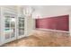 Dining area with tile floors, access to pool, and accent wall at 1749 W Monterosa St, Phoenix, AZ 85015