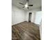 Spacious bedroom with wood-look floors and ceiling fan at 2112 N 24Th Pl, Phoenix, AZ 85008