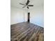 Bright bedroom with wood-look floors and ceiling fan at 2112 N 24Th Pl, Phoenix, AZ 85008