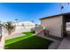 Landscaped backyard with artificial turf and privacy fence at 245 S 56Th St # 75, Mesa, AZ 85206