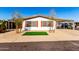 House exterior featuring a carport and landscaping at 245 S 56Th St # 75, Mesa, AZ 85206