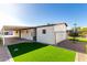 View of the house exterior with artificial turf at 245 S 56Th St # 75, Mesa, AZ 85206