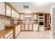 Galley style kitchen with wood cabinets and appliances at 245 S 56Th St # 75, Mesa, AZ 85206