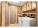 Bright laundry room, featuring washer, dryer, and ample storage at 245 S 56Th St # 75, Mesa, AZ 85206