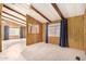 Living area with wood paneling and window coverings at 245 S 56Th St # 75, Mesa, AZ 85206