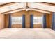 Bright living room with wood beams and large windows at 245 S 56Th St # 75, Mesa, AZ 85206