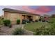 Spacious backyard with a covered patio and grassy area at 2456 E Lindrick Dr, Gilbert, AZ 85298