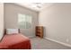 Small bedroom with twin bed and bookshelf at 2456 E Lindrick Dr, Gilbert, AZ 85298