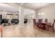 Open dining room with a wood table and blue chairs at 2456 E Lindrick Dr, Gilbert, AZ 85298