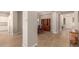 Dining area with wood flooring and a view into the kitchen at 2456 E Lindrick Dr, Gilbert, AZ 85298