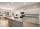 Modern kitchen featuring white cabinets, granite countertops, and stainless steel appliances at 2456 E Lindrick Dr, Gilbert, AZ 85298