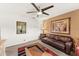 Bright bedroom with a leather sofa and an ensuite bathroom at 29806 N 43Rd Pl, Cave Creek, AZ 85331