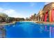 Inviting kidney-shaped pool with rock landscaping and red accents at 29806 N 43Rd Pl, Cave Creek, AZ 85331