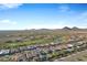 Beautiful aerial view of a golf course community with mountain views at 30807 N 117Th Dr, Peoria, AZ 85383