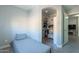 Small bedroom with twin bed and built-in shelving at 3339 E Tonopah Dr, Phoenix, AZ 85050