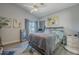Main bedroom with a king-size bed and access to backyard at 3339 E Tonopah Dr, Phoenix, AZ 85050