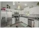 Modern kitchen with stainless steel appliances and white shaker cabinets at 3339 E Tonopah Dr, Phoenix, AZ 85050