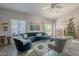 Living room with sectional sofa, decorative accents and a Christmas tree at 3339 E Tonopah Dr, Phoenix, AZ 85050
