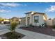 Picturesque single-story home with a two-car garage and attractive desert landscaping at 40015 W Crane Dr, Maricopa, AZ 85138