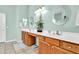 Double vanity bathroom with wood cabinets and large mirrors at 4735 E Azalea Dr, Gilbert, AZ 85298