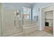 Bathroom with shower, bathtub and walk-in closet at 4735 E Azalea Dr, Gilbert, AZ 85298