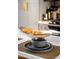 Kitchen counter with place settings and fruit bowl at 49 E Virginia Ave, Phoenix, AZ 85004