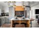 Modern kitchen with gray cabinets,hexagon tile backsplash, and an island at 49 E Virginia Ave, Phoenix, AZ 85004