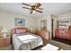 Bedroom with double bed, dresser, and ceiling fan at 5525 E Thomas Rd # N1, Phoenix, AZ 85018