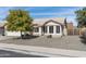 Single-story home with a landscaped front yard and a two-car garage at 6522 E Fox St, Mesa, AZ 85205