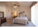 Guest bedroom with a double bed and wood furniture at 8598 E Saguaro Blossom Rd, Gold Canyon, AZ 85118