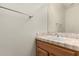 Clean bathroom with tiled countertop, wood vanity, and single sink at 9501 E Cherrywood Dr, Sun Lakes, AZ 85248