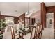 Formal dining room with glass-top table and wood chairs at 9501 E Cherrywood Dr, Sun Lakes, AZ 85248