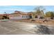 Single story home with three car garage and desert landscaping at 9501 E Cherrywood Dr, Sun Lakes, AZ 85248