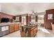 Bright kitchen with an island, views to backyard, and updated countertops at 9501 E Cherrywood Dr, Sun Lakes, AZ 85248