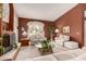 Spacious living room with fireplace and large windows at 9501 E Cherrywood Dr, Sun Lakes, AZ 85248