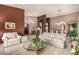Open living room with views into dining room and entryway at 9501 E Cherrywood Dr, Sun Lakes, AZ 85248