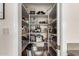Well-organized pantry with ample shelving for storage at 9501 E Cherrywood Dr, Sun Lakes, AZ 85248
