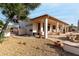 Covered patio with seating area and desert landscaping at 9501 E Cherrywood Dr, Sun Lakes, AZ 85248