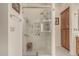 Walk-in shower with glass enclosure, seat, and multiple shower heads at 9501 E Cherrywood Dr, Sun Lakes, AZ 85248