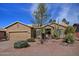 Single-story home with desert landscaping and a two-car garage at 1072 E Winged Foot Dr, Chandler, AZ 85249