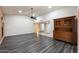 Living room with wood-look flooring, ceiling fan, and open floor plan at 1462 Leisure World --, Mesa, AZ 85206