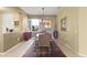 Elegant dining room with wood table and chairs, and an area rug at 19521 N Copper Canyon Ct, Surprise, AZ 85387